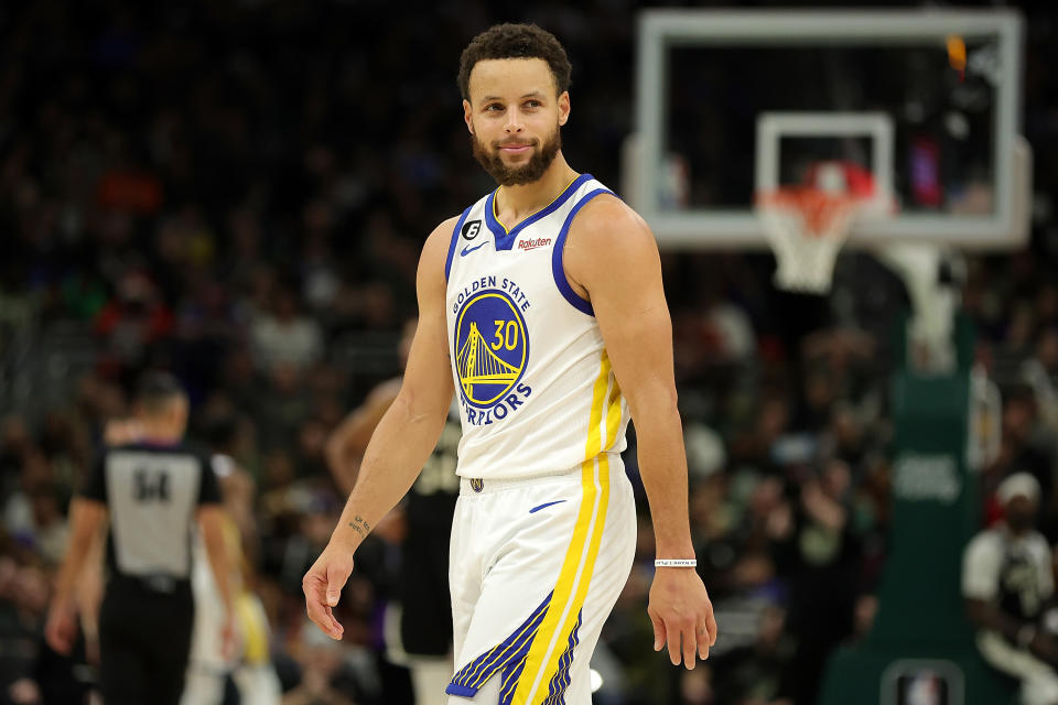 MILWAUKEE, WISCONSIN - DECEMBER 13: Stephen Curry #30 of the Golden State Warriors walks backcourt during a game against the Milwaukee Bucks at Fiserv Forum on December 13, 2022 in Milwaukee, Wisconsin. The Bucks defeated the Warriors 128-111. NOTE TO USER: User expressly acknowledges and agrees that, by downloading and or using this photograph, User is consenting to the terms and conditions of the Getty Images License Agreement. (Photo by Stacy Revere/Getty Images)