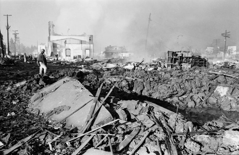 Firefighters visit the blast crater in Roseburg in 1959.