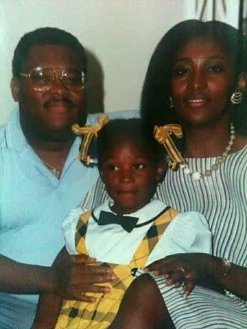 <p>Melissa Chataigne</p> A childhood photo of Melissa Chataigne with her parents, who immigrated from Haiti