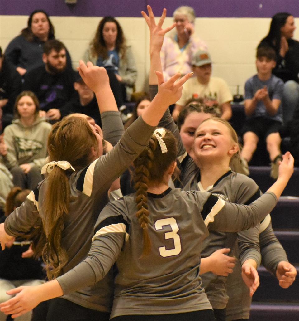 Little Falls players celebrate scoring the final point against Morrisville-Eaton in Wednesday's Section III Class C winter playoff match.