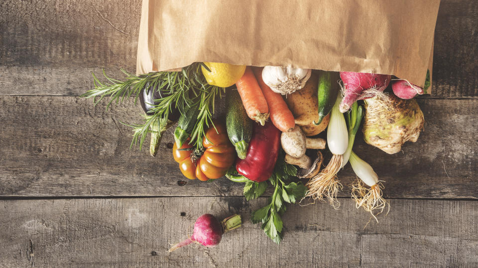 A grocery bag filled with produce