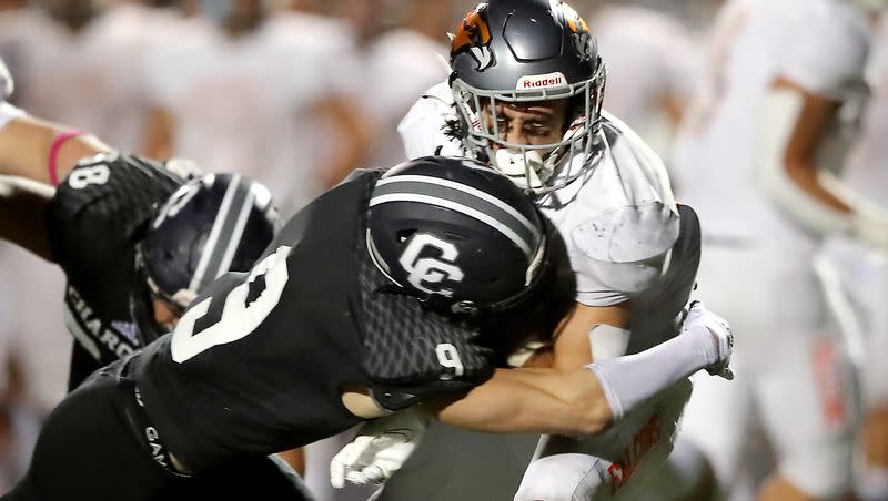 Corner Canyon’s Harrison Taggart brings down Skyridge’s Jeter Fenton during a high school football game at Corner Canyon in Draper on Friday, Sept. 24, 2021. Taggart announced Saturday night that he is transferring from Oregon to BYU.