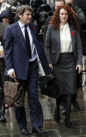 Former News International Chief Executive Rebekah Brooks arrives with her husband Charlie at the Old Bailey courthouse in London October 31, 2013. REUTERS/Luke MacGregor