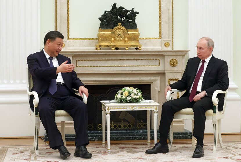 Chinese President Xi Jinping gestures as he speaks to Russian President Vladimir Putin during their meeting at the Kremlin in Moscow, Russia, Monday, March 20, 2023. (Sergei Karpukhin, Sputnik, Kremlin Pool Photo via AP)