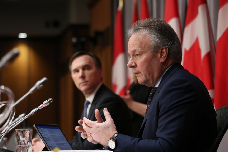 Bank of Canada Governor Stephen Poloz (R) and Finance Minister Bill Morneau (L) speaksduring a news conference on Parliament Hill March 18, 2020 in Ottawa, Ontario. - Canadian Prime Minister Justin Trudeau announced Can$27 billion in direct aid on March 18, 2020 to help workers and businesses cope with the economic impacts of the coronavirus pandemic.He said tax payments worth an estimated Can$55 billion could be deferred until August. (Photo by Dave Chan / AFP) (Photo by DAVE CHAN/AFP via Getty Images)