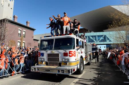 Feb 9, 2016; Denver, CO, USA; Denver Broncos players celebrate during the Super Bowl 50 championship parade at Civic Center Park. Mandatory Credit: Ron Chenoy-USA TODAY Sports