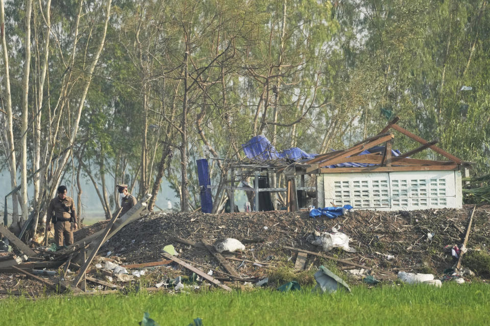 Thai police officers inspect the site of an explosion at a fireworks factory in Suphan Buri province, Thailand, Thursday, Jan. 18, 2024. The blast in central Thailand killed multiple people on Wednesday, according to provincial officials, though the devastation at the scene has made the death toll uncertain. (AP Photo/Sakchai Lalit)