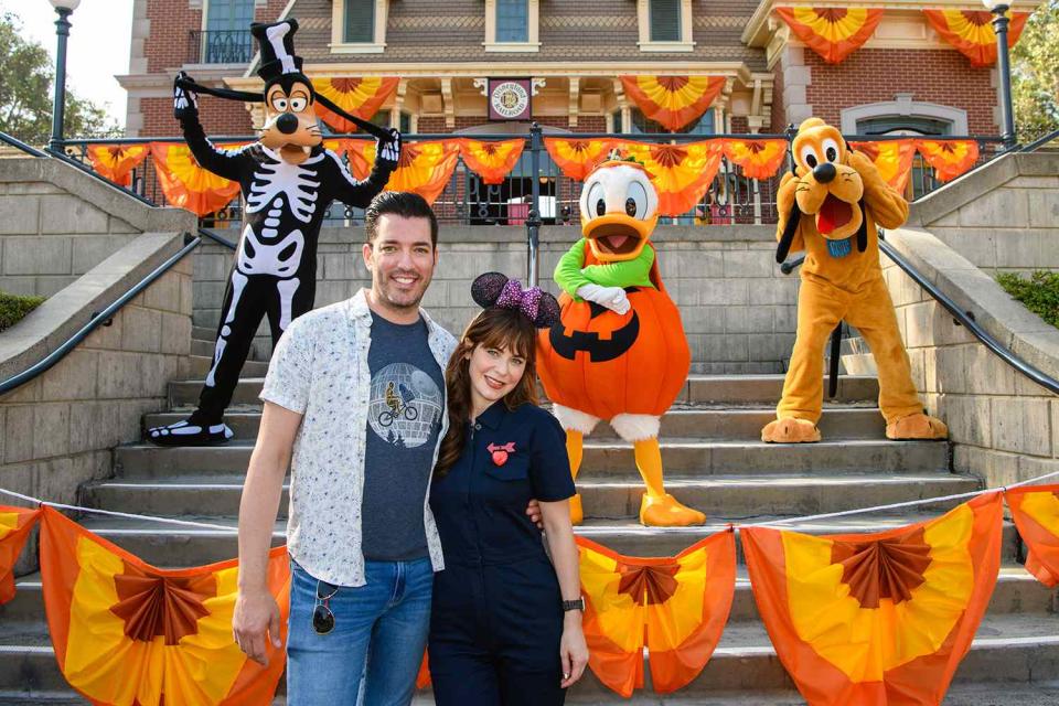 <p>The <em>Property Brothers</em> star and the <em>New Girl</em> actress, who have been dating for two years, visited Disneyland in California this past weekend. Seen here with Goofy, Donald and Pluto, the couple got in the spooky spirit by celebrating the park's family-friendly "Halloween Time" events.</p>