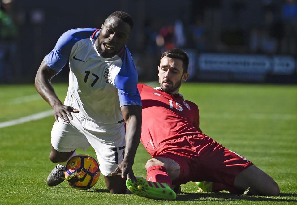 United States' Jozy Altidore, left, is taken down by Serbia's Stephan Panic during a friendly soccer match, Sunday, Jan. 29, 2017 in San Diego. (AP Photo/Denis Poroy)