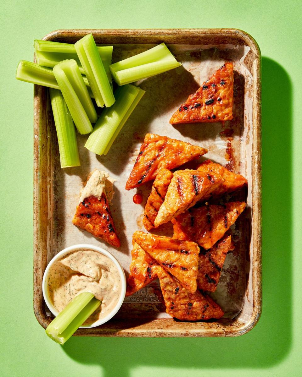 <p>Quicker to make and easier to eat than <a href="https://www.delish.com/cooking/recipe-ideas/recipes/a51133/classic-buffalo-wings-recipe/" rel="nofollow noopener" target="_blank" data-ylk="slk:Buffalo chicken wings;elm:context_link;itc:0;sec:content-canvas" class="link ">Buffalo chicken wings</a>, this plant-based version swaps chicken for snackable triangles of <a href="https://www.delish.com/food-news/a40973028/what-is-tempeh/" rel="nofollow noopener" target="_blank" data-ylk="slk:tempeh;elm:context_link;itc:0;sec:content-canvas" class="link ">tempeh</a> to mimic the crowd-pleasing appetizer.</p><p>Get the <strong><a href="https://www.delish.com/cooking/recipe-ideas/a36973370/tempeh-wings-recipe/" rel="nofollow noopener" target="_blank" data-ylk="slk:Tempeh Buffalo “Wings” recipe;elm:context_link;itc:0;sec:content-canvas" class="link ">Tempeh Buffalo “Wings” recipe</a></strong>.</p>