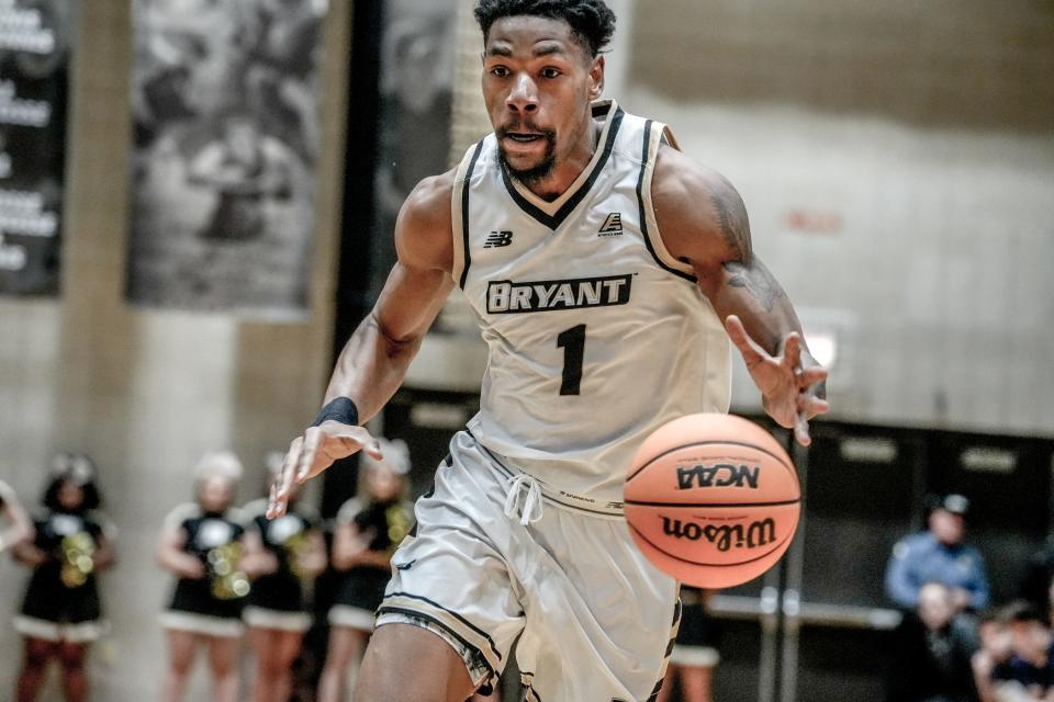 Bryant's Antwan Walker brings the ball up the court during Saturday's game against New Hampshire. Walker finished with 20 points and 10 rebounds for a double-double.