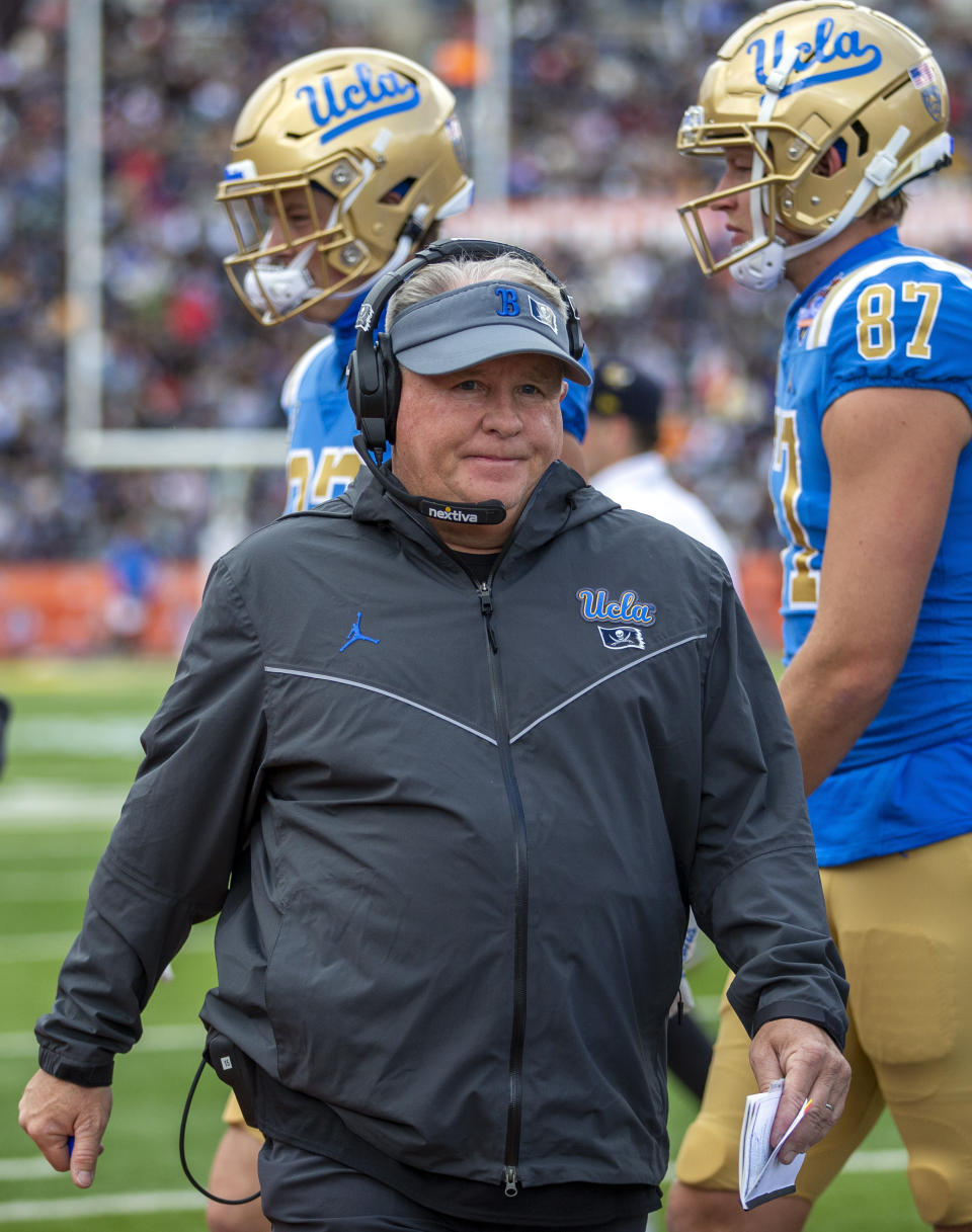 FILE - UCLA coach Chip Kelly walks back to the sidelines during a time out in the first half of the Sun Bowl NCAA college football game against Pittsburgh, Friday, Dec. 30, 2022 in El Paso, Texas. Chip Kelly has informed UCLA officials that he is stepping down as coach of the Bruins, a person with direct knowledge of the decision told The Associated Press on Friday, Feb. 9, 2024.(AP Photo/Andres Leighton, File)