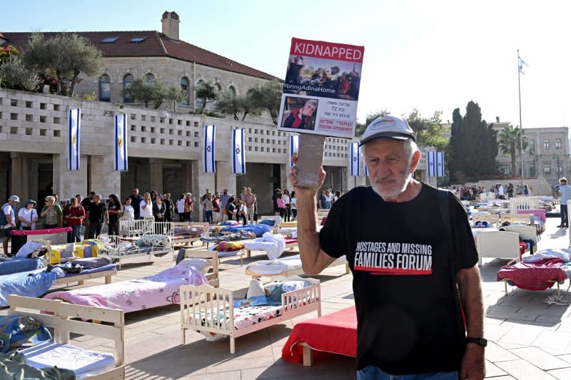 People view an installation called "Empty Beds" symbolizing the 230 empty beds of Israeli hostages held by Hamas in Gaza since Oct. 7 in Safra Square in Jerusalem on Monday. Photo by Debbie Hill/ UPI