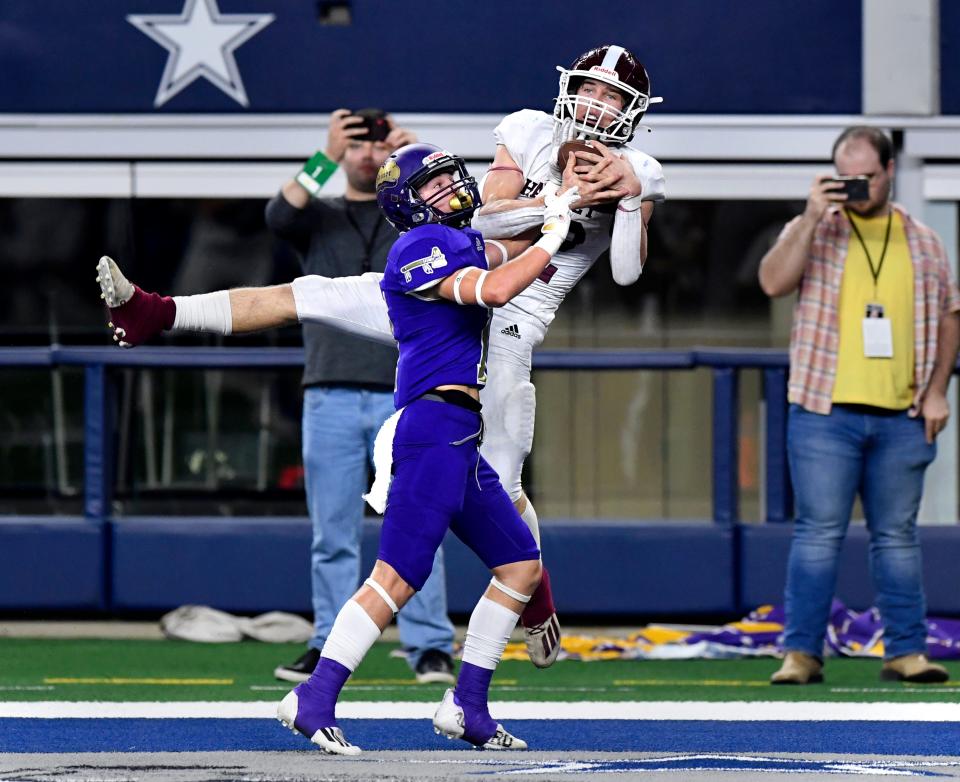 Hawley wide receiver Will Scott catches a pass in the end zone for touchdown despite coverage from Shiner defensive back Jace Moeller during Wednesday's Class 2A Div. I state championship game in Arlington.