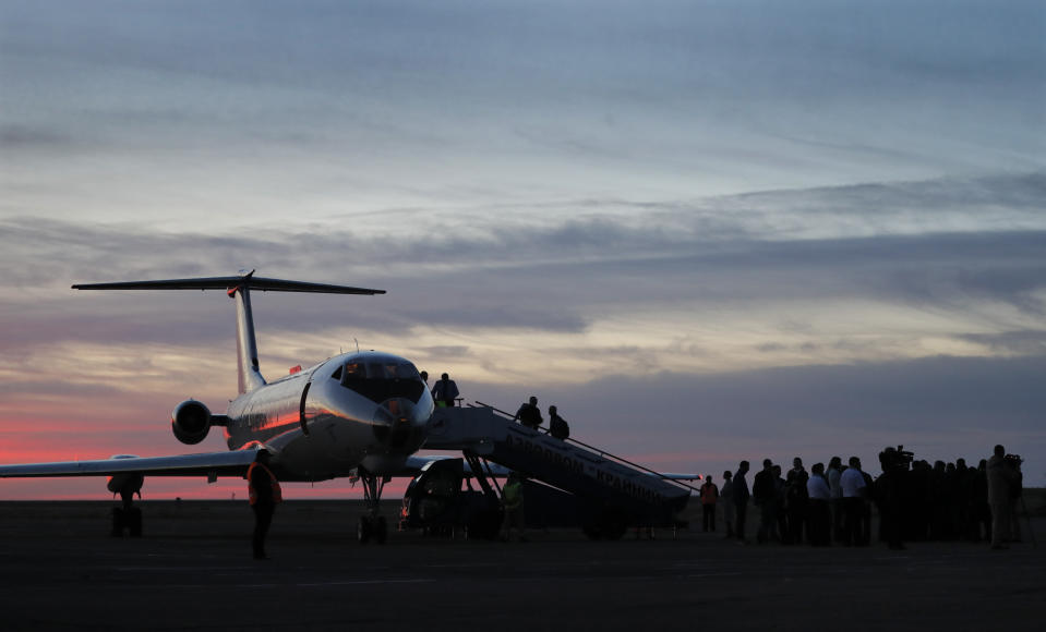 An aircraft carrying U.S. astronaut Nick Hague and Russian cosmonaut Alexey Ovchinin on board arrives at Baikonur airport, in Kazakhstan, Thursday, Oct. 11, 2018. Two astronauts from the U.S. and Russia were safe Thursday after an emergency landing in the steppes of Kazakhstan following the failure of a Russian booster rocket carrying them to the International Space Station. (Yuri Kochetkov/Pool Photo via AP