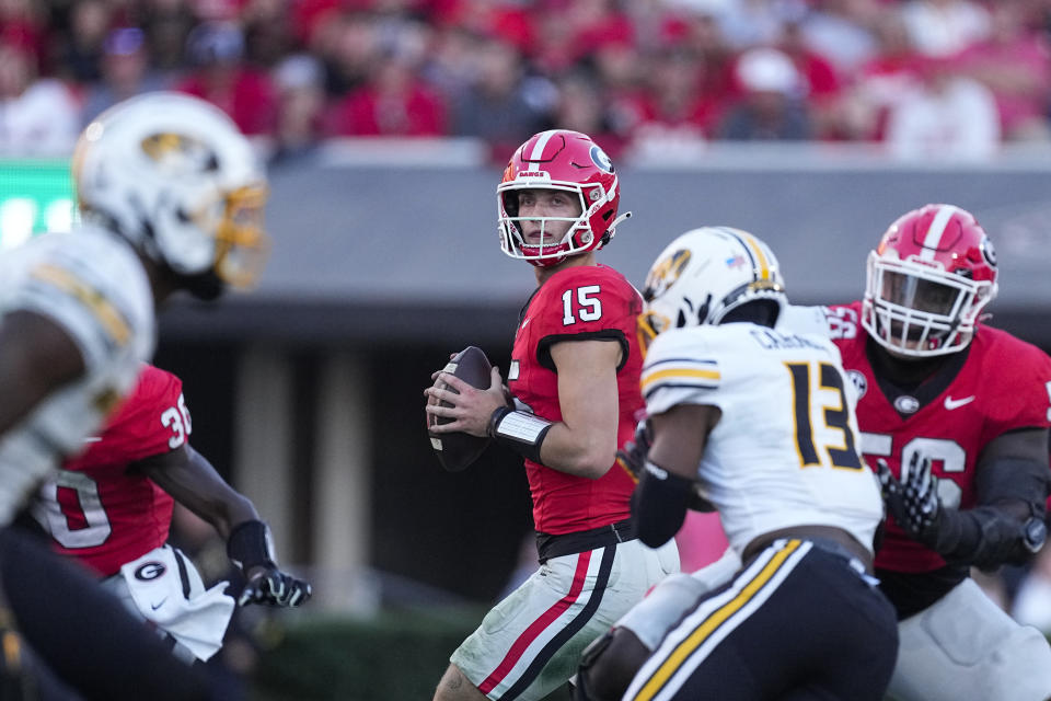 Georgia quarterback Carson Beck (15) looks for an open receiver during the second half of an NCAA college football game against Missouri , Saturday, Nov. 4, 2023, in Athens, Ga. (AP Photo/John Bazemore)