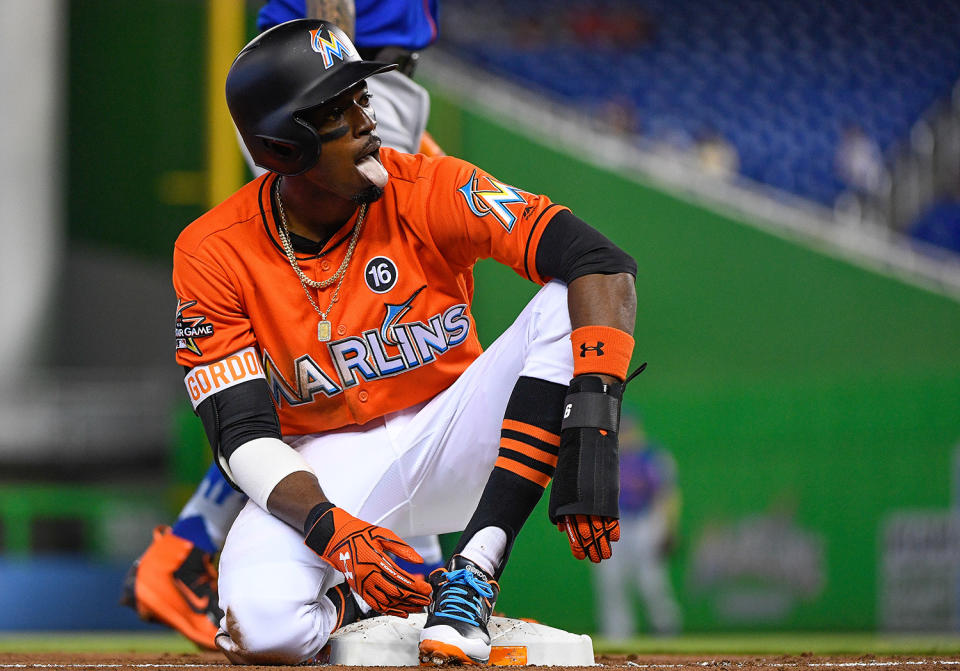 Dee Gordon reacts after being called safe on third