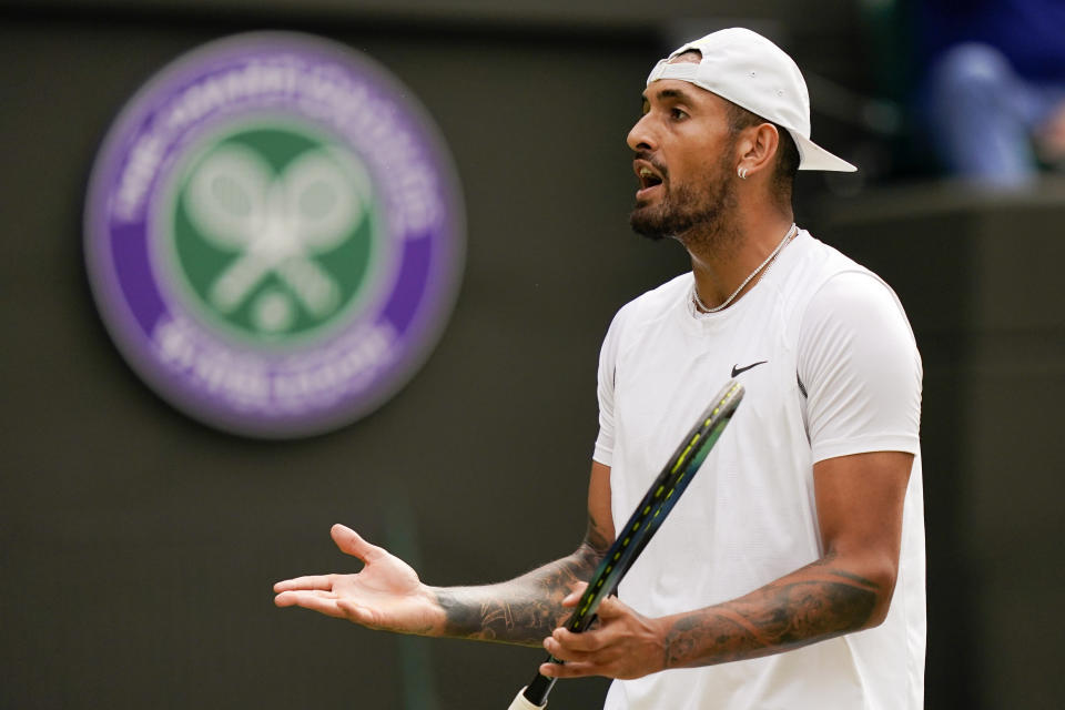 Australia's Nick Kyrgios reacts during a men's singles quarterfinal match against Chile's Cristian Garin on day ten of the Wimbledon tennis championships in London, Wednesday, July 6, 2022. (AP Photo/Alberto Pezzali)