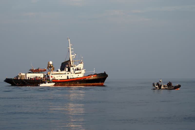 FILE PHOTO: A RHIB of the Italian Finance Police patrols near the Mare Jonio, operated by Italian charity Mediterranea Saving Humans, and the German NGO Sea-Eye migrant rescue ship 'Alan Kurdi' of the Italian island of Lampedusa