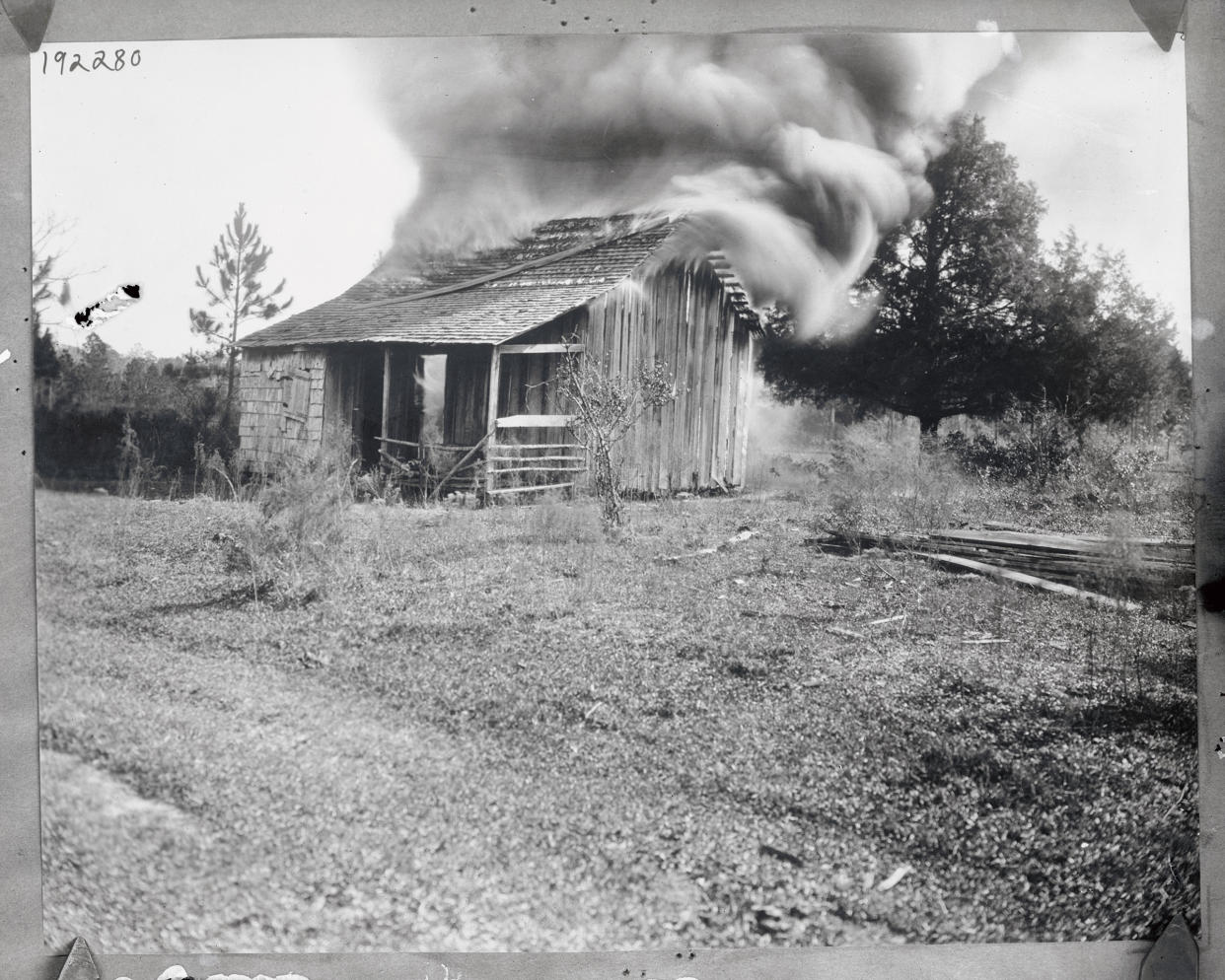 A home burns on Jan. 9, 1923, during a white mob’s attacks on the Black community of Rosewood, Fla.