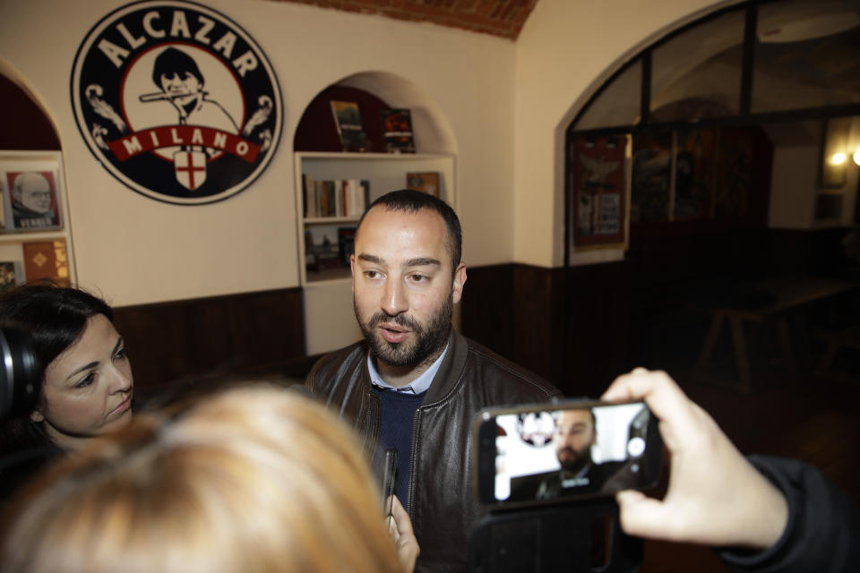 Francesco Polacchi, regional coordinator of Casapound extreme right political party, and founder of Altaforte publishing company, answers to reporters during a news conference, in Milan, Italy, Wednesday, May 8, 2019. Holocaust survivor, poet Halina Birenbaum, is set to open a book fair in Turin after the organizers agreed to demands that she and the Auschwitz-Birkenau state museum made to remove the stand of Altaforte publishing company. (AP Photo/Luca Bruno)