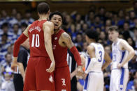 Louisville guards Samuell Williamson (10) and Lamarr Kimble celebrate at the end of the team's NCAA college basketball game against Duke in Durham, N.C., Saturday, Jan. 18, 2020. Louisville won 79-73. (AP Photo/Gerry Broome)