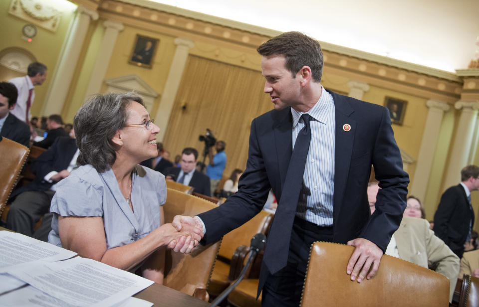 UNITED STATES - JUNE 04: Sue Martinek of the Coalition for Life of Iowa, talks with Rep. Aaron Schock, R-Ill., before a House Ways and Means Committee hearing in Longworth Building to investigate the IRS's scrutiny of politically based groups. Witnesses included leaders of conservative political groups. (Photo By Tom Williams/CQ Roll Call)