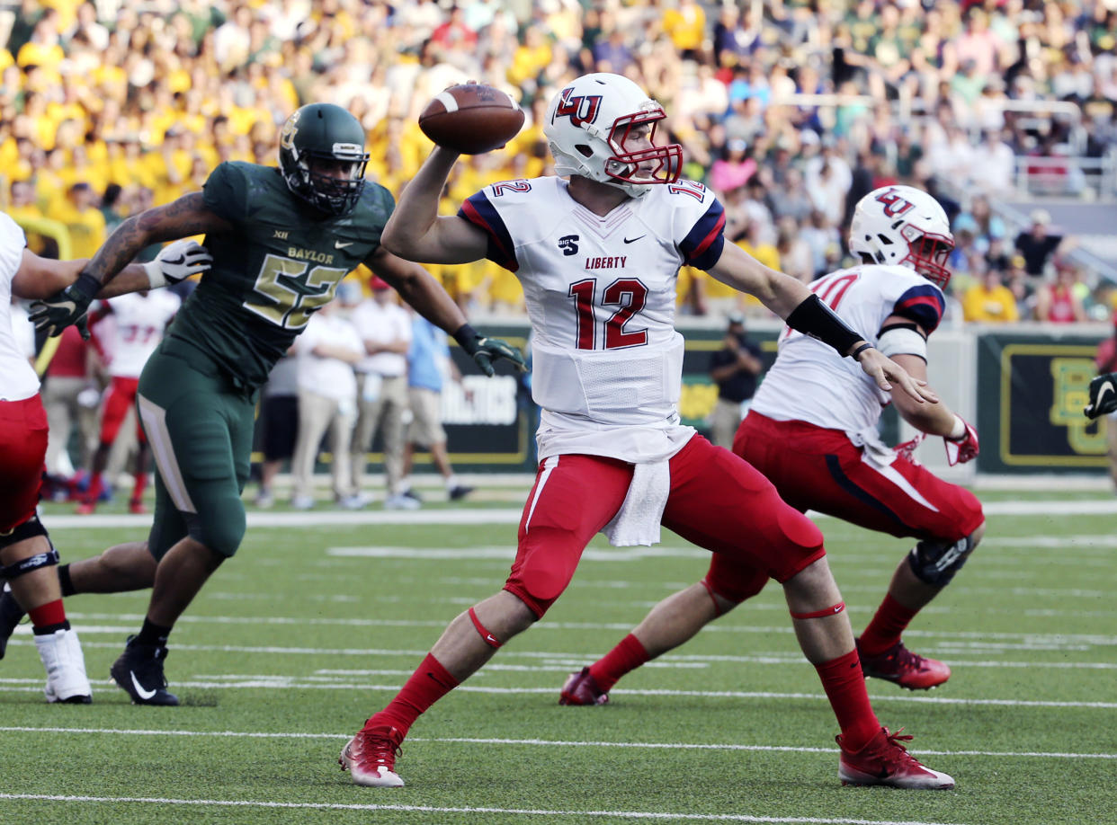 Liberty quarterback Stephen Calvert throws downfield against Baylor in the first half of an NCAA college football game, Saturday, Sept. 2, 2017, in Waco, Texas. (Jerry Larson/Waco Tribune Herald, via AP)