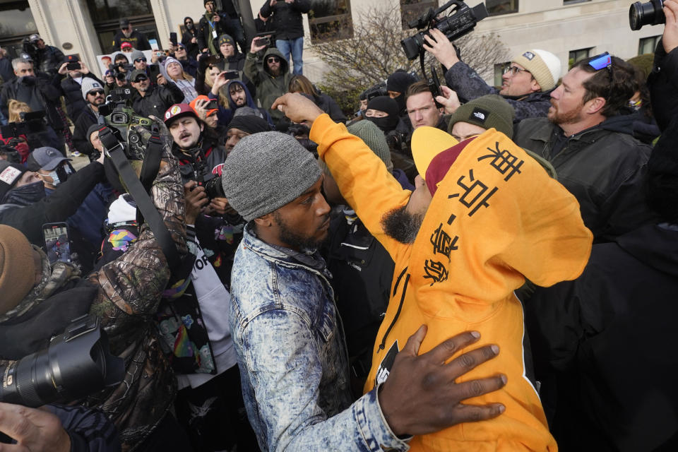 Protesters argue outside the Kenosha County Courthouse, Friday, Nov. 19, 2021, in Kenosha, Wis. Kyle Rittenhouse was acquitted of all charges after pleading self-defense in the deadly Kenosha shootings that became a flashpoint in the nation's debate over guns, vigilantism and racial injustice. (AP Photo/Paul Sancya)