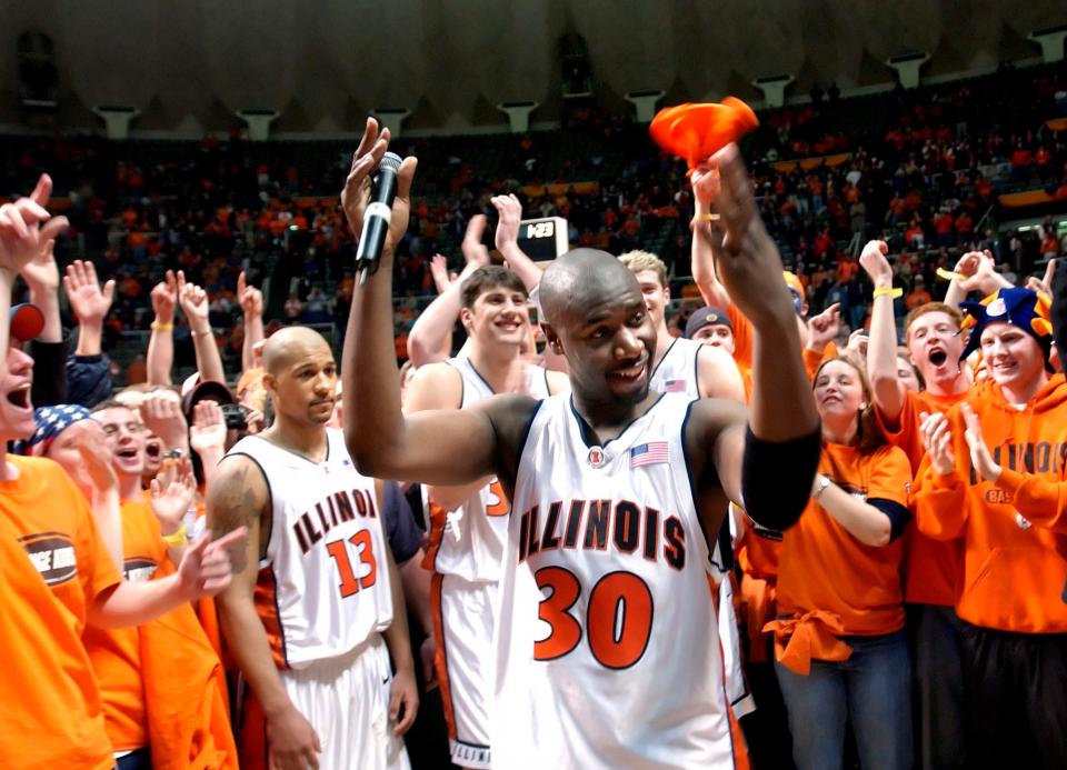 Illini star and Peoria product Frank Williams celebrates during ceremonies presenting him with his jersey back in March 14, 2002.