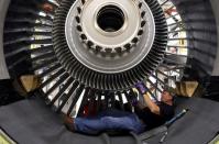 FILE PHOTO: General Electric employee Jim Jones assembles a GE90 engine at the GE Aviation Peebles Test Operations Facility in Peebles, Ohio