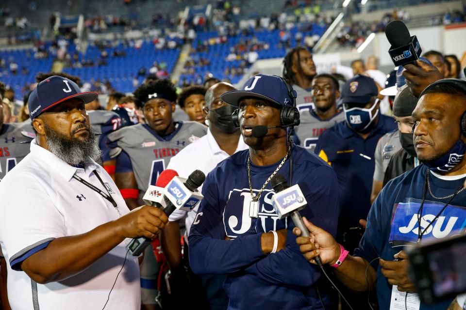 Jackson State head coach Deion Sanders wears a headset and answers questions from the press box in the Southern Heritage Classic between Tennessee State University and Jackson State University at Liberty Bowl Memorial Stadium in Memphis, Tenn., on Saturday, Sept. 11, 2021. 