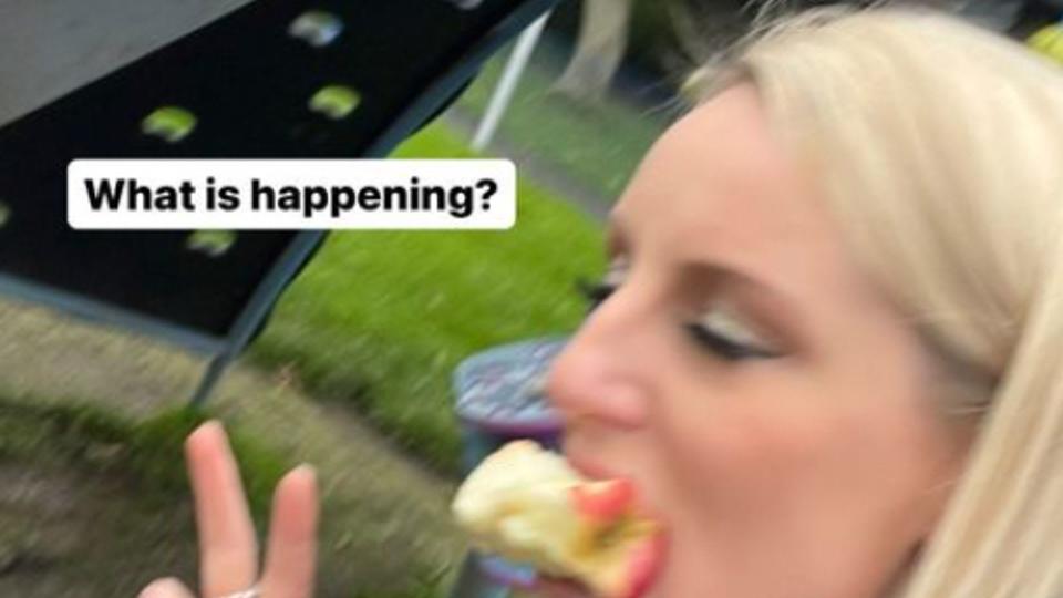 Blurry photo of Steph McGovern eating an apple