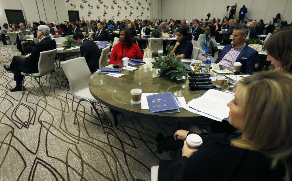 Attendees listen to a discussion on criminal justice reform, at the Mississippi Summit on Criminal Justice Reform in Jackson, Miss., Tuesday, Dec. 11, 2018. The meeting was put on by a coalition of groups that favor changes to reduce harshness in the criminal justice system. (AP Photo/Rogelio V. Solis)