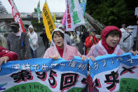 Participants march after a May Day rally in Tokyo, Wednesday, May 1, 2024. (AP Photo/Hiro Komae)