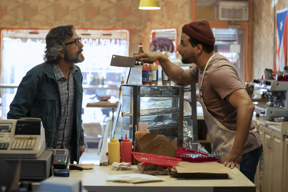 Luis (Alejandro Hernandez), the owner of Empanada Loca, argues with his landlord, Gideon Pearlman (Marc Maron), who has been threatening to evict him.<span class="copyright">Jasper Savage—Prime Video</span>