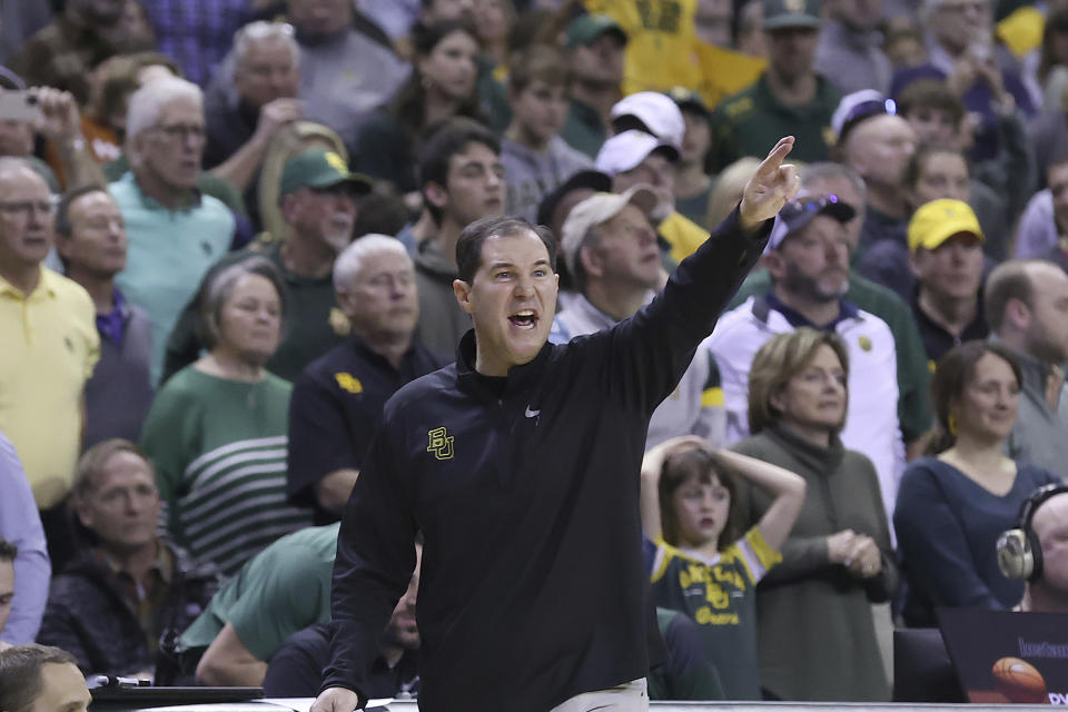 Baylor head coach Scott Drew calls in a play to his team during the second half of an NCAA college basketball game against Texas Saturday, Feb. 25, 2023, in Waco, Texas. (AP Photo/Jerry Larson)