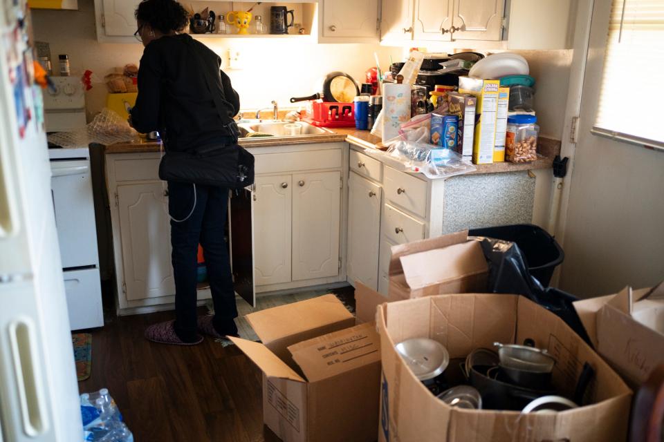 Cynthia Wray, who has sickle cell anemia, slowly packs up her apartment Monday, Dec. 11, 2023, at Colonial Village in Columbus, where she has lived there for 12 years. The management at the East Side complex has given all of its residents until Dec. 31 to move out into other housing so it can begin repairs and improvements.