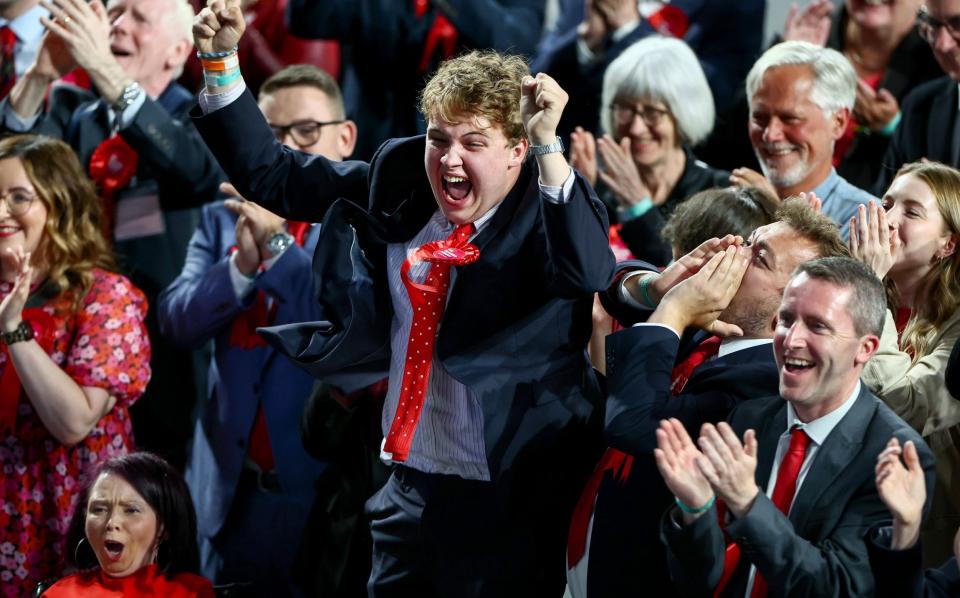 Scottish Labour supporters celebrate after the party scored victory in exit polls at declaration for Glasgow North East