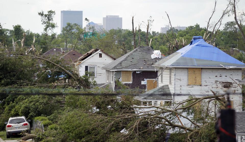 Tornado battered houses and trees along Rolfe Avenue in Harrison Twp. near Wagner Ford Road.  WHIO File