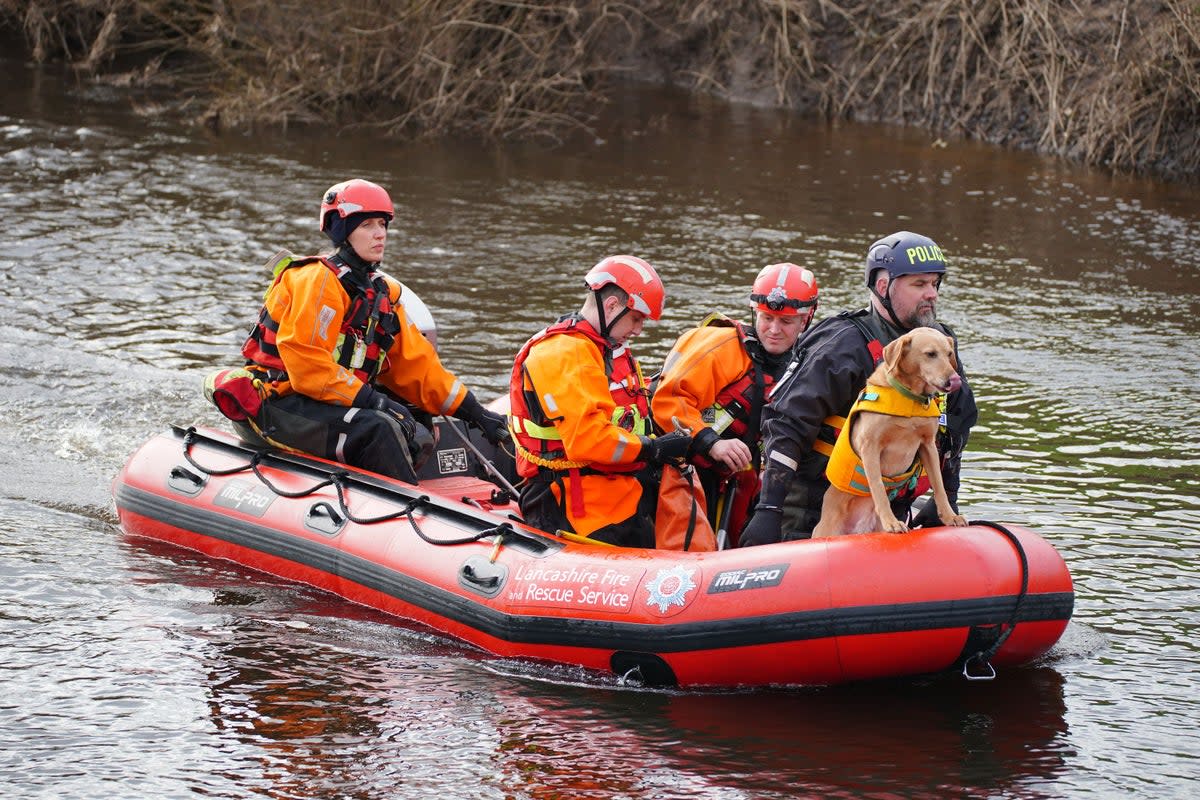 Specialist search teams from Lancashire Fire and Rescue Service and the police, on the River Wyre (PA Wire)