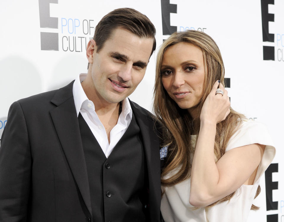 FILE - This April 30, 2012 file photo shows Bill Rancic, left, and his wife Giuliana Rancic attending an E! Network upfront event at Gotham Hall in New York. The couple have welcomed son Edward Duke to their family. Edward was born in Denver via a gestational surrogate on Wednesday, Aug. 29. He weighed 7 pounds and 4 ounces. The couple was in the delivery room for the four-hour labor and birth. Giuliana Rancic is a red-carpet fixture and host of E! News, and Bill is an entrepreneur and motivational speaker, who was the first-season winner on TV's “The Apprentice.” Together, they star in a Style Network reality show called “Giuliana & Bill” that dealt with their fertility issues. (AP Photo/Evan Agostini, file)