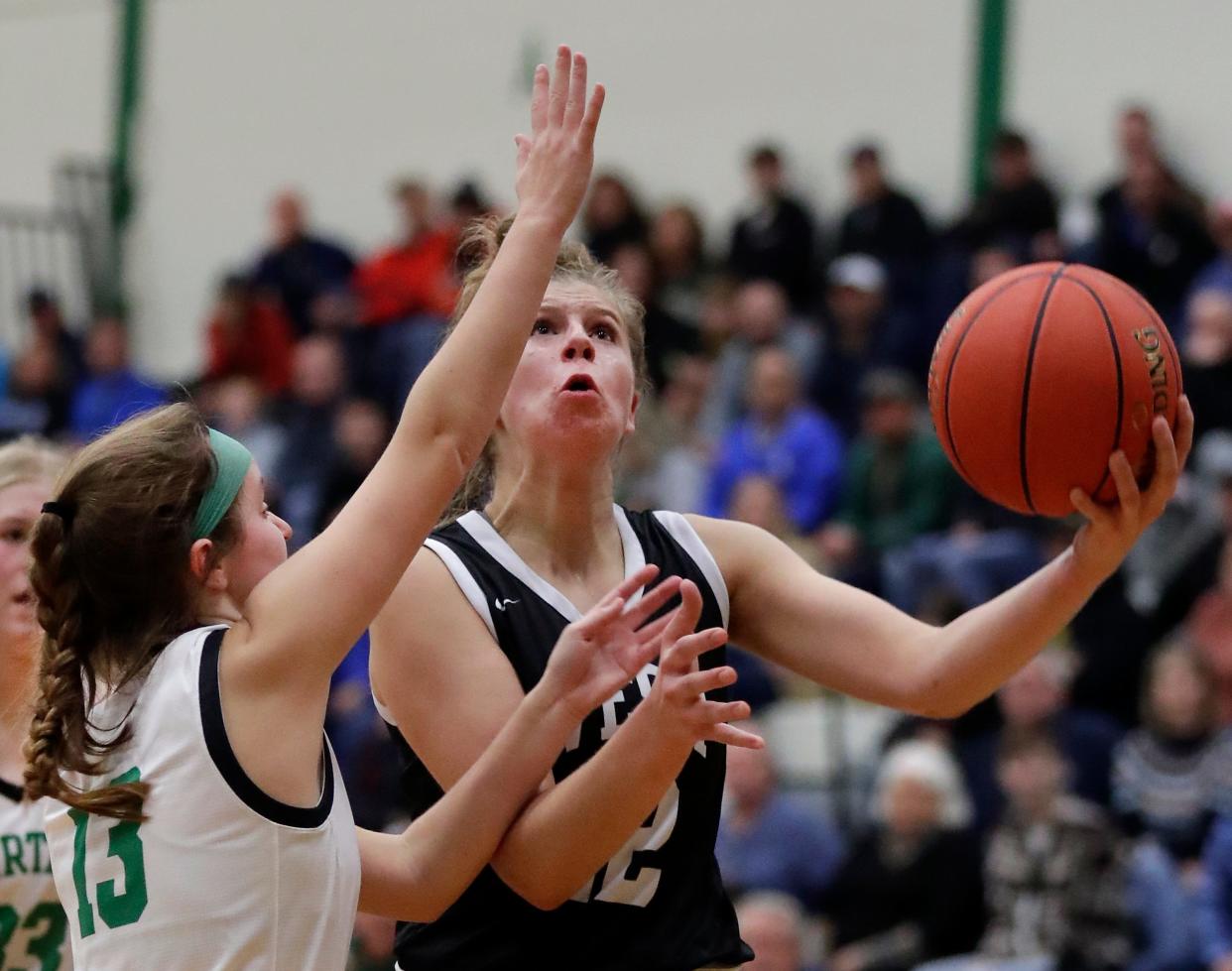 Oshkosh West High School's Paige Seckar (22) against Oshkosh North High School’s Lauren Geer (13) during their girls basketball game on Friday, December 2, 2022, at North High School in Oshkosh, Wis. West defeated North 59-48Wm. Glasheen USA TODAY NETWORK-Wisconsin