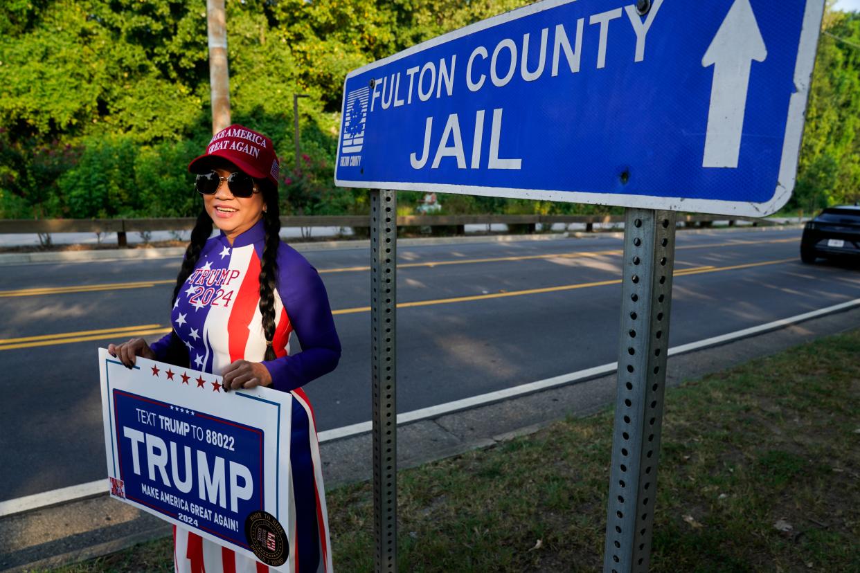 Ngoc Trang and protesters around the Fulton County Jail intake center in Atlanta, GA on Aug. 24, 2023, the day former President Donald Trump plans to surrender to Atlanta authorities. A grand jury in Fulton County, Georgia indicted former president Donald Trump and 18 other defendants with 41 charges related to tampering with the 2020 election. All defendants have been ordered to turn themselves in by August 25.