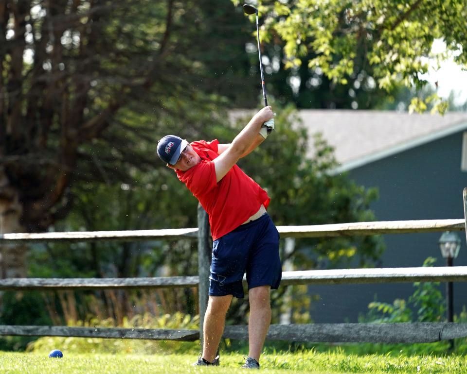 Jace Day hits a tee shot during his Men’s Championship title match against Nick Burris in the Bloomington City Golf Tournament at Cascades Golf Course Sunday.