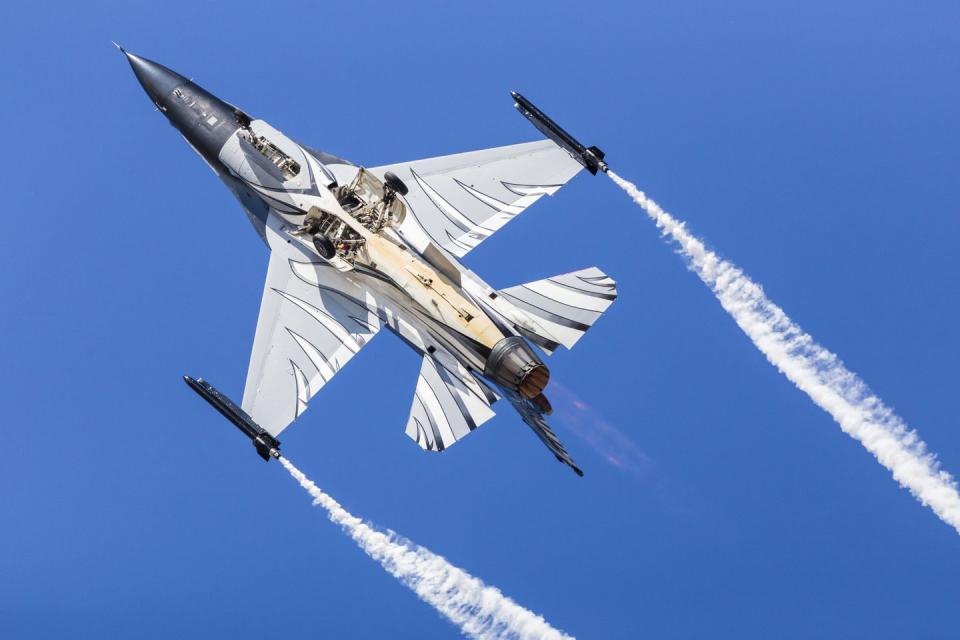belgian air component f 16am performing under a blue sky