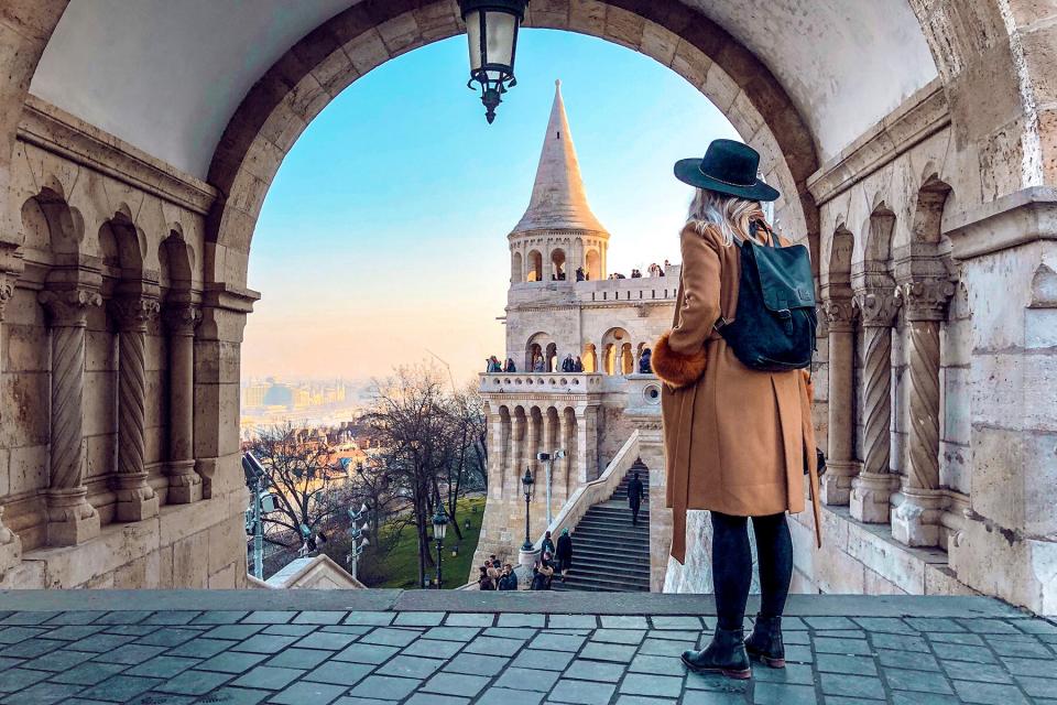 A Woman Standing In a Historic Building in Budapest