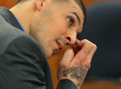 Aaron Hernandez wipes his face as he listens to the judge instruct the jury during his murder trial. (AP)