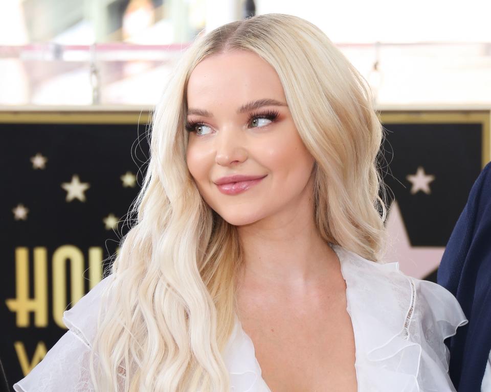 Dove Cameron looks amazing in all-white outfit at an Hollywood event, and the smile on her face is breath-taking.