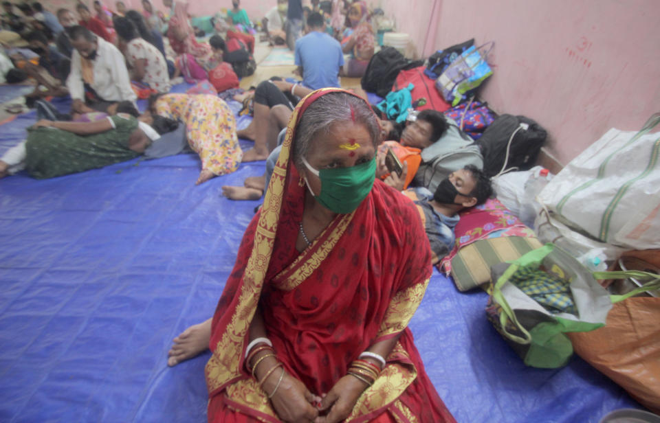 Residents rest in a shelter ahead of the expected landfall of cyclone Amphan in Dhamra area of Bhadrak district, 160 km away from the eastern Indian state Odisha's capital city as the Cyclone 'Amphan' cross the Bay of Bengal Sea's eastern coast making devastation on the cyclonic weather wind and rain and make landfall on the boarder of West Bengal and Bangladesh on May 20, 2020. (Photo by STR/NurPhoto via Getty Images)